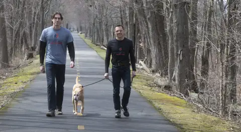 A Hadley father leaves the corporate world to train dogs with his son